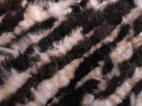Rug / chair throw, woven, dark